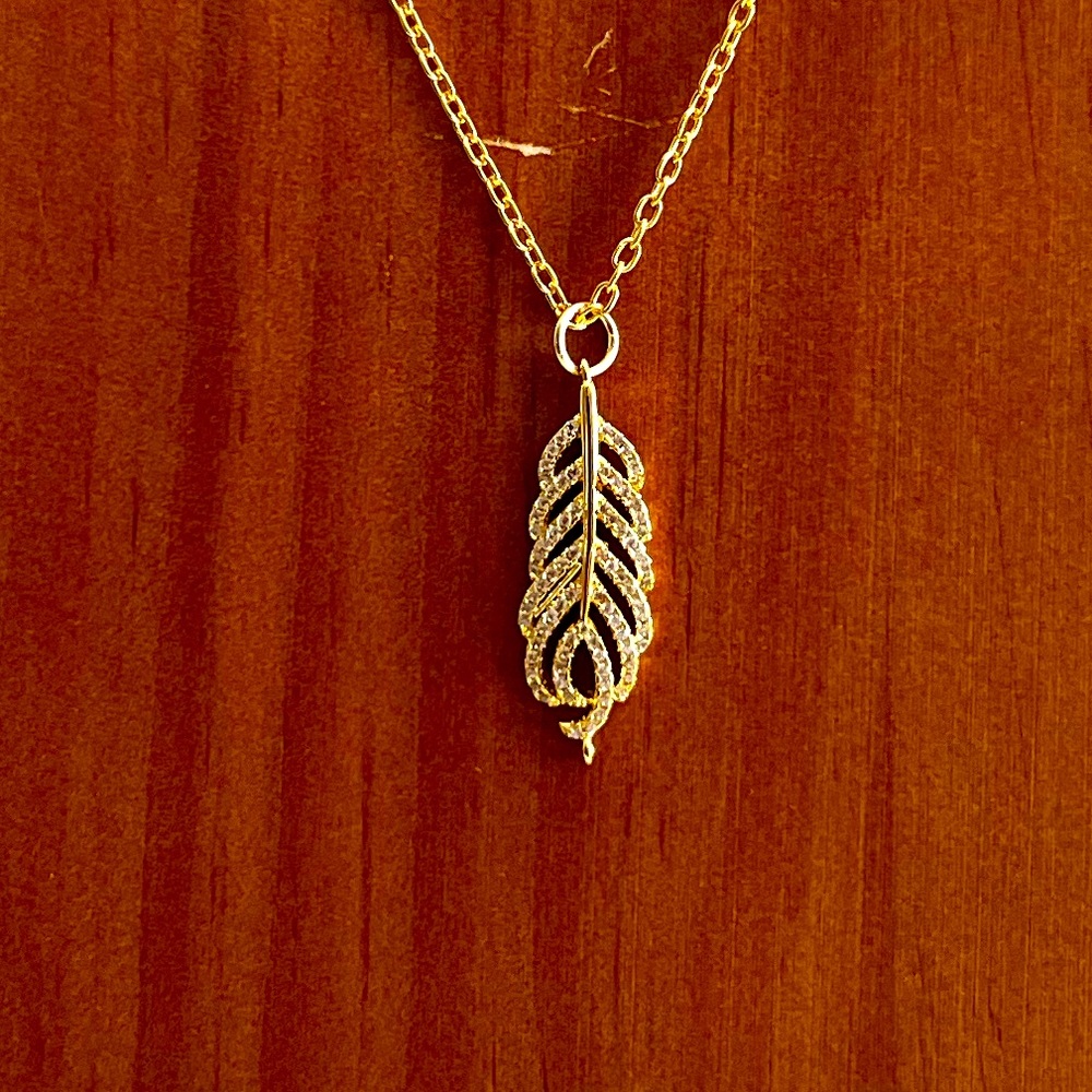 Gold fill pave encrusted feather on gold fill chain
